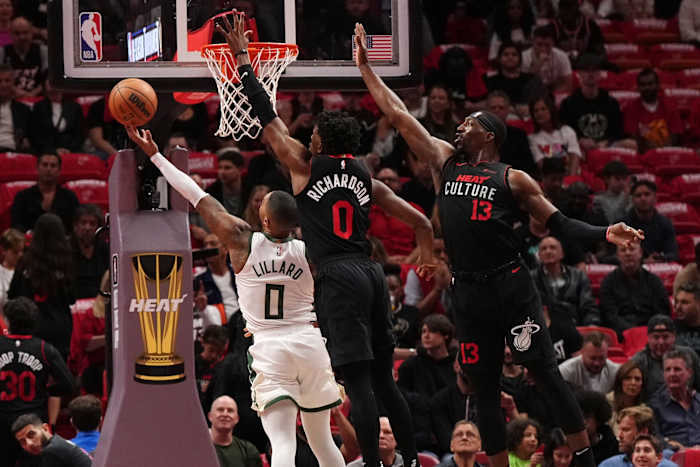 Milwaukee Bucks guard Damian Lillard (0) puts up a shot against Miami Heat guard Josh Richardson (0)